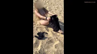 Stripping off all my clothes on the beach